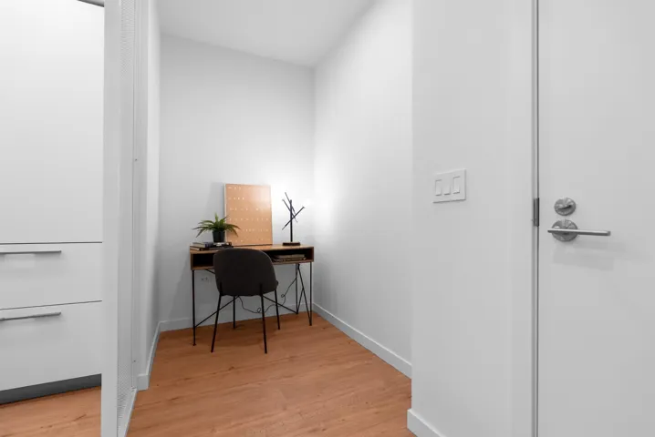 Office area featuring light wood-type flooring and baseboards