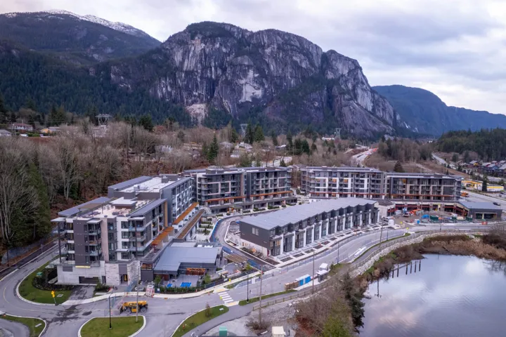 Aerial overview of property's location with mountains and apartment complex