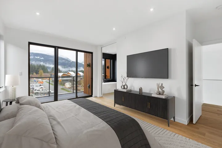 Bedroom with light wood finished floors, access to exterior, and recessed lighting