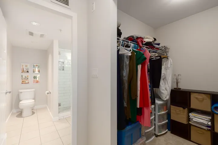 Walk in closet and view into ensuite