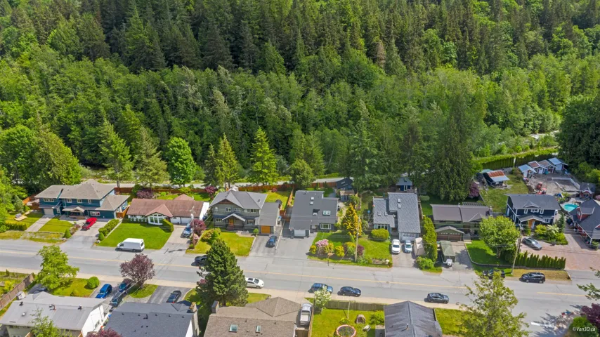 Aerial view of residential area with a heavily wooded area