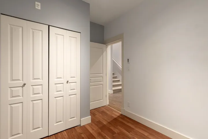 Bi-fold closet doors with panel detailing