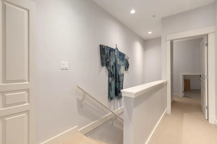 Upper-level hallway featuring recessed lighting, a neutral color palette, and carpeted flooring