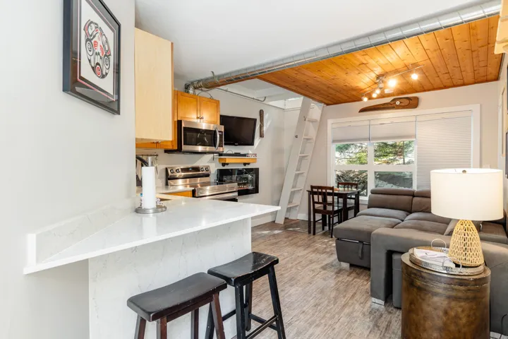 Living area featuring wood ceiling and light wood finished floors