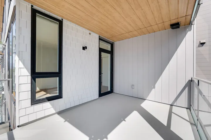 Unfurnished bedroom with light wood-type flooring and a closet