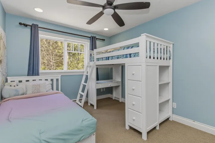 Bedroom featuring light carpet, ceiling fan, and recessed lighting