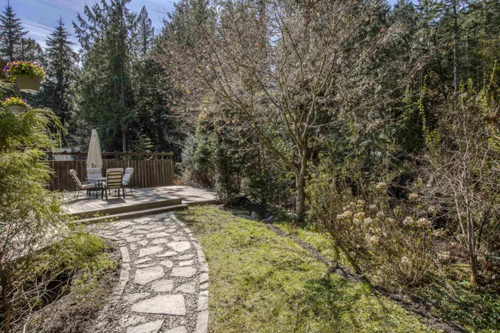 View of yard with a wooden deck