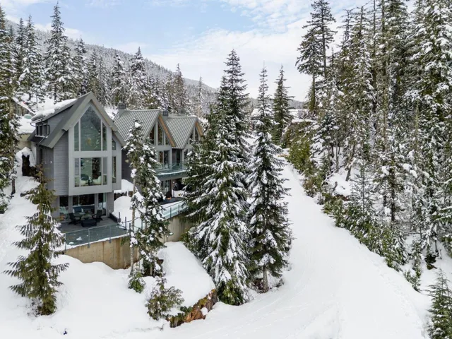 View of snowy exterior with a balcony
