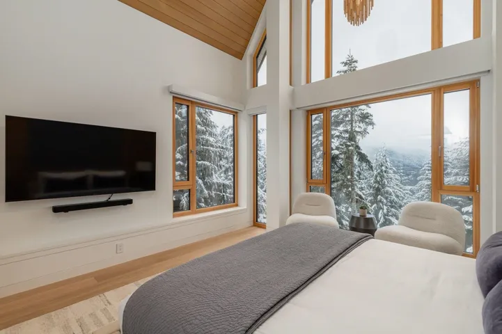 Bedroom featuring light wood-style floors, high vaulted ceiling, and wood ceiling