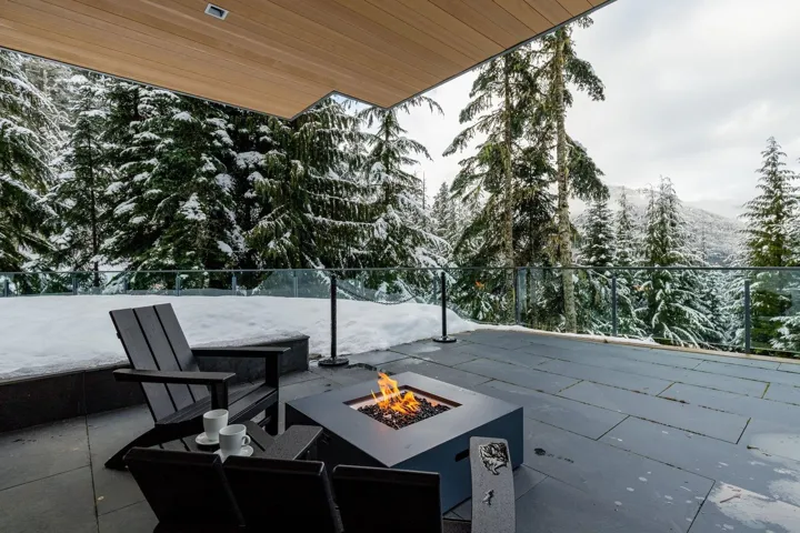 View of patio with an outdoor fire pit