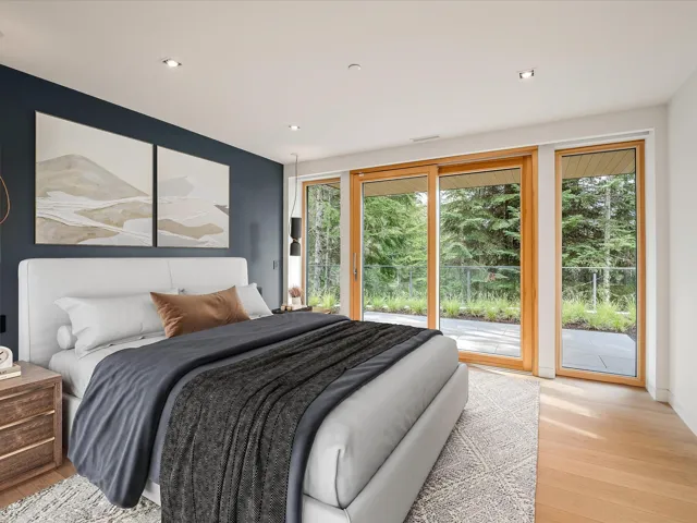 Bedroom featuring access to outside, light wood-type flooring, and recessed lighting