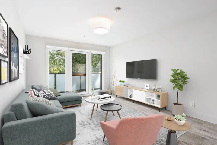 Living area with wood finished floors and baseboards