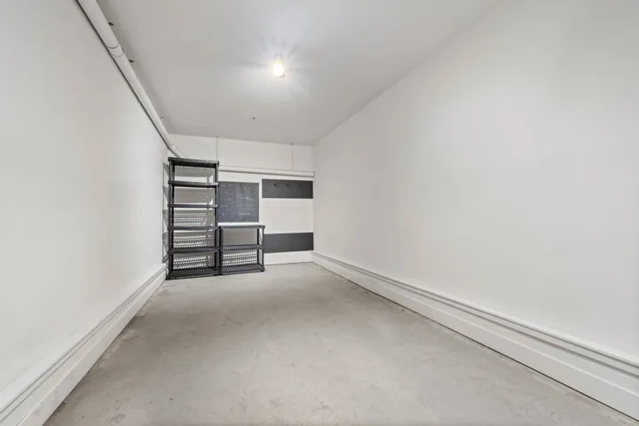 Unfurnished room featuring concrete flooring
