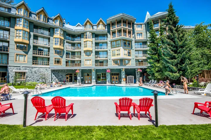 Community pool with a patio