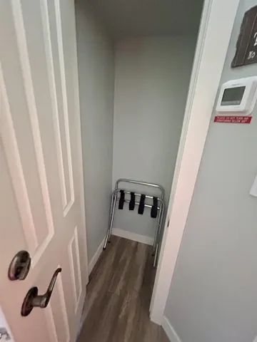 Detailed view of wood finished floors and baseboards