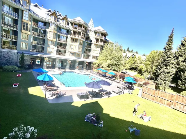 Community pool featuring a patio