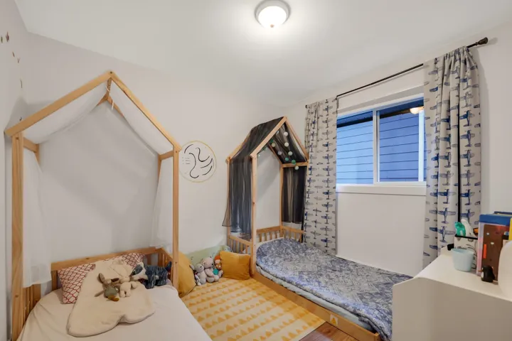 Well-lit interior room featuring a recessed window with blinds, a flush-mount ceiling light, and light-toned walls