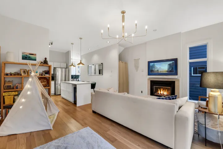 Open-concept living area with wood-finish flooring
