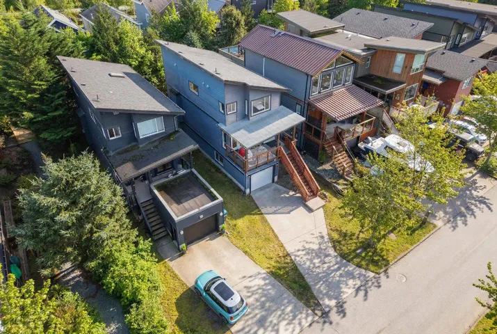 Modern residential architecture with varied rooflines and exterior finishes