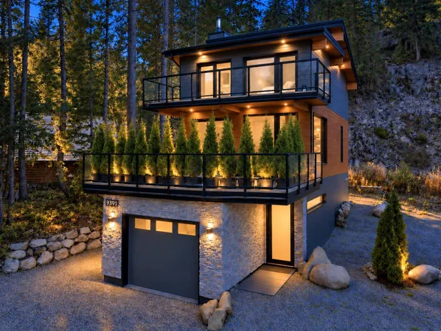 Multi-level modern residence featuring two upper-level balconies with glass railings