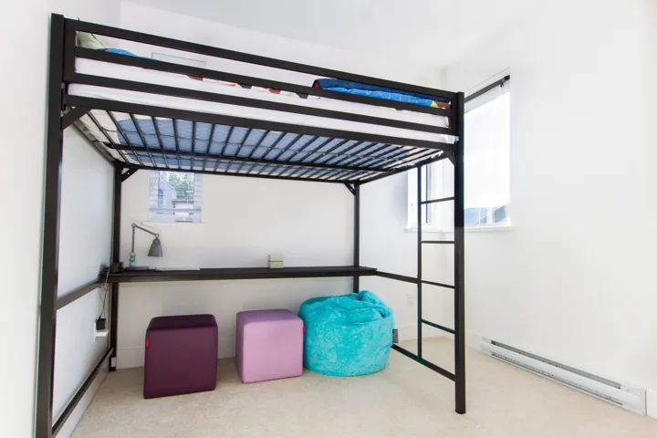 Interior space with a baseboard radiator and carpet flooring