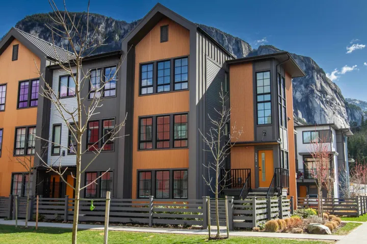 View of front of property with a fenced front yard and a mountain view