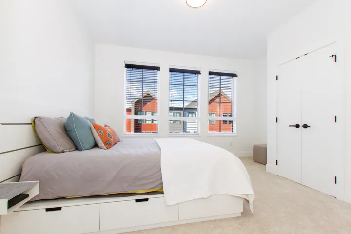 Bedroom with a closet and light carpet