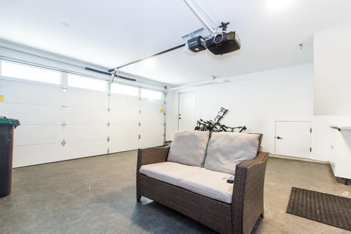 Garage featuring a garage door opener