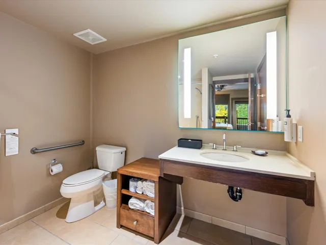 Full bath featuring light tile patterned floors and toilet