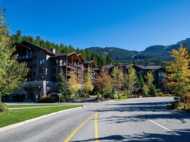 View of asphalt street featuring a mountain view and curbs