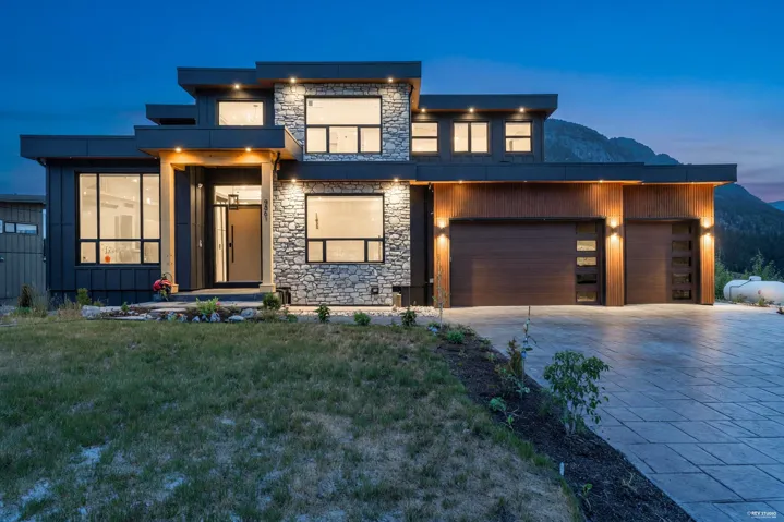 Modern exterior showcasing stacked stone and dark paneling