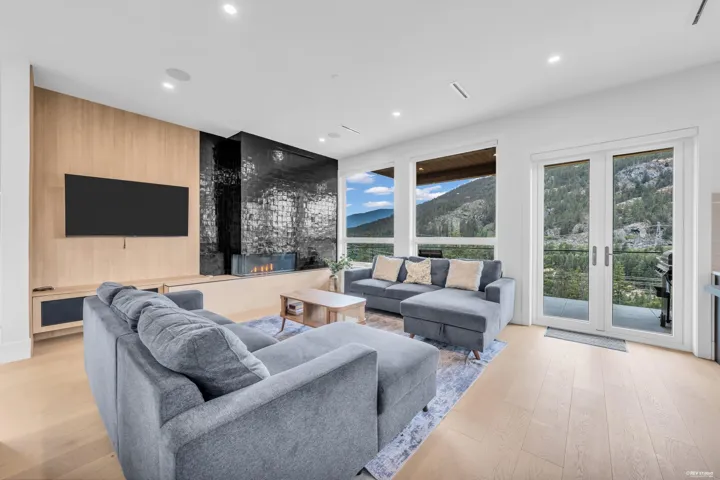 Open concept living area featuring light wood-finish flooring