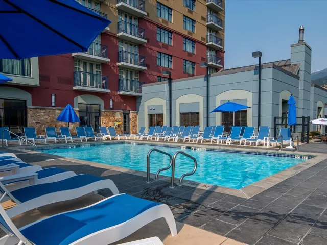 Community pool with a patio