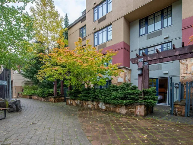 View of property's community featuring a pergola and a patio area