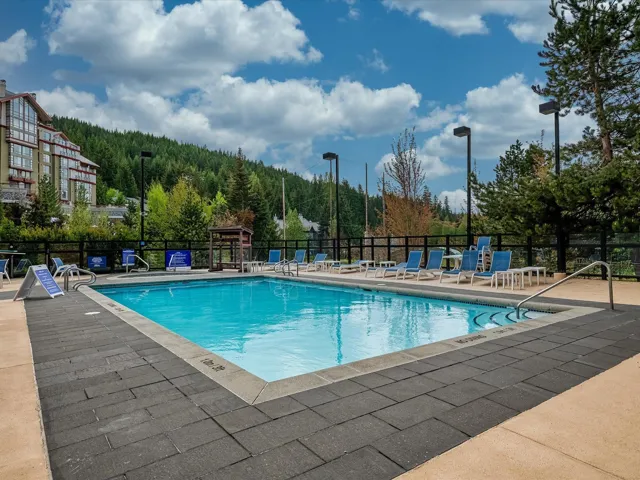 Community pool with a patio area