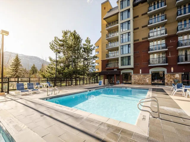 Community pool featuring a patio area and a mountain view