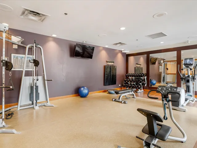 Gym featuring baseboards and recessed lighting
