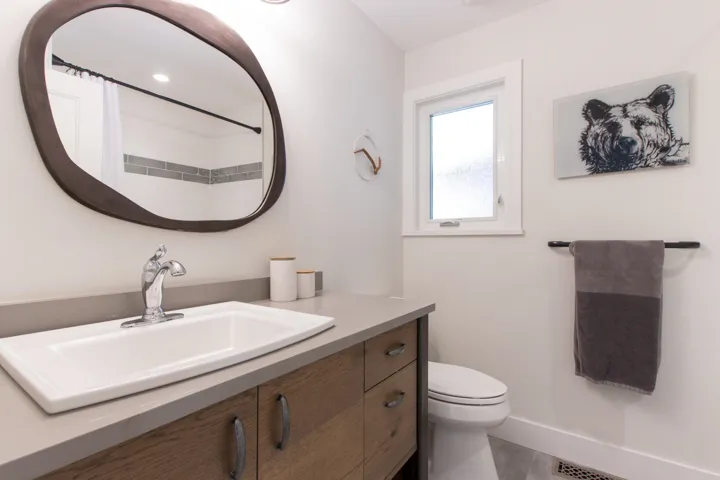 Full bath with vanity and curtained shower