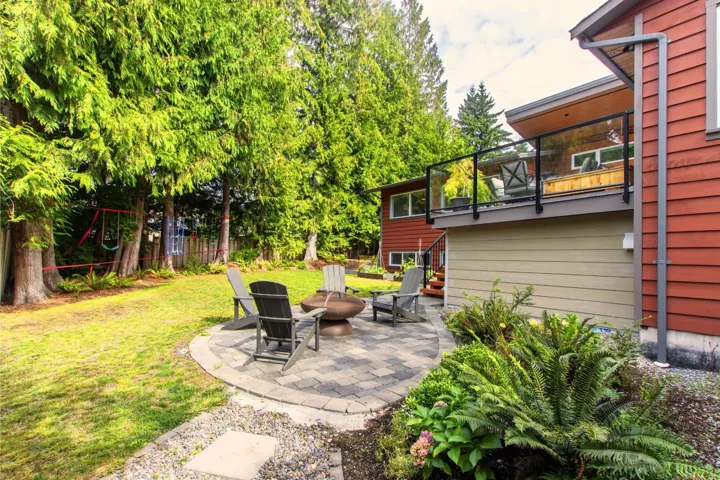 Patio / terrace with a patio area, a fire pit, and stairs