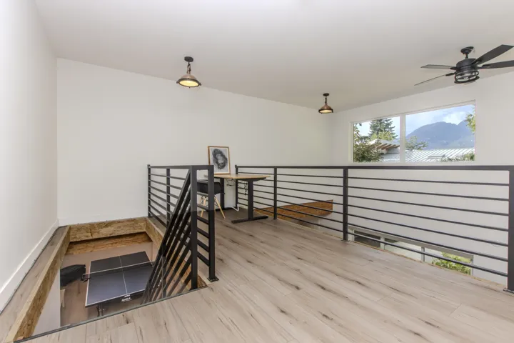 Hallway with an upstairs landing and a mountain view