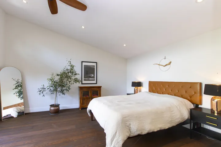 Bedroom with vaulted ceiling, dark wood-type flooring, recessed lighting, and a ceiling fan