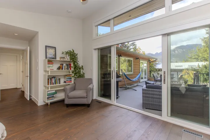 Living area featuring a mountain view, hardwood / wood-style flooring, and plenty of natural light