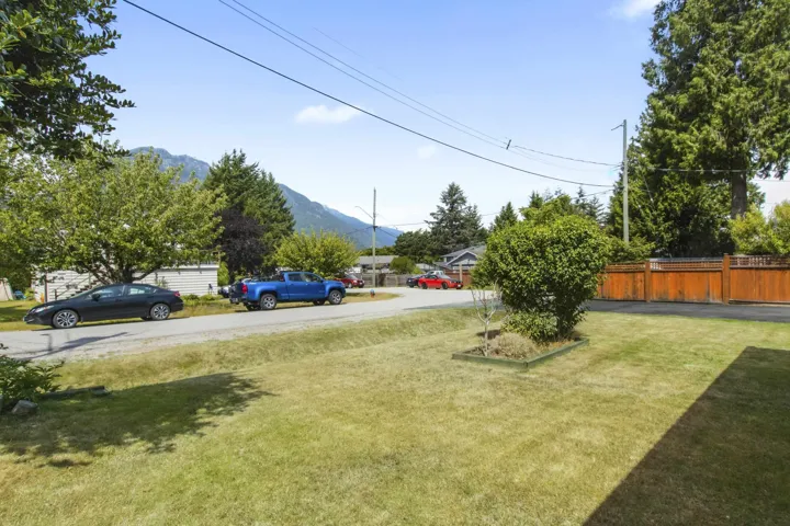 Expansive lawn area with a defined planting bed