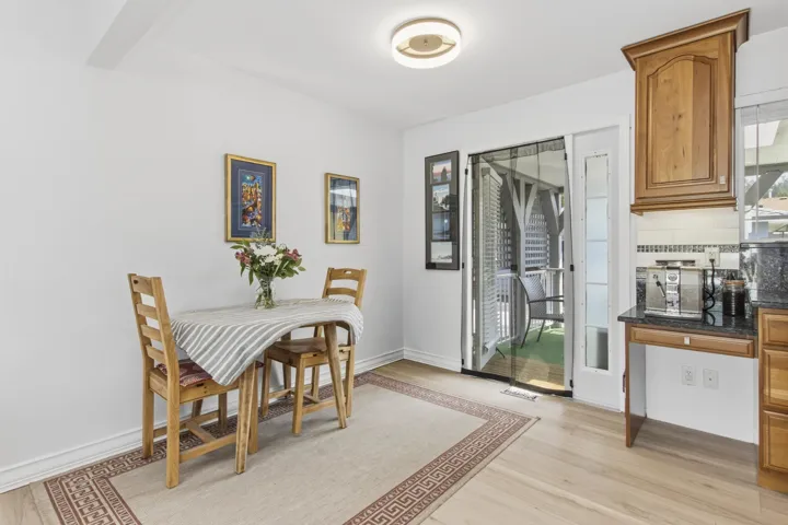 Light wood-finish flooring complements white walls
