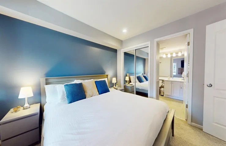 Bedroom featuring light carpet, recessed lighting, a closet, and ensuite bathroom