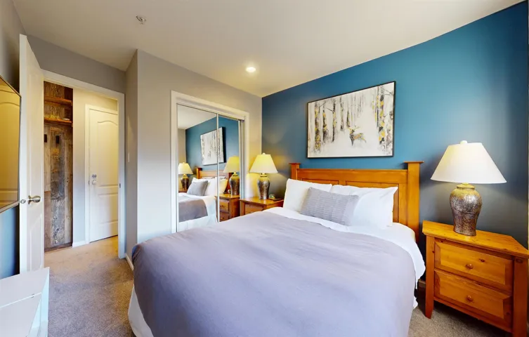 Bedroom with carpet floors, recessed lighting, and a closet