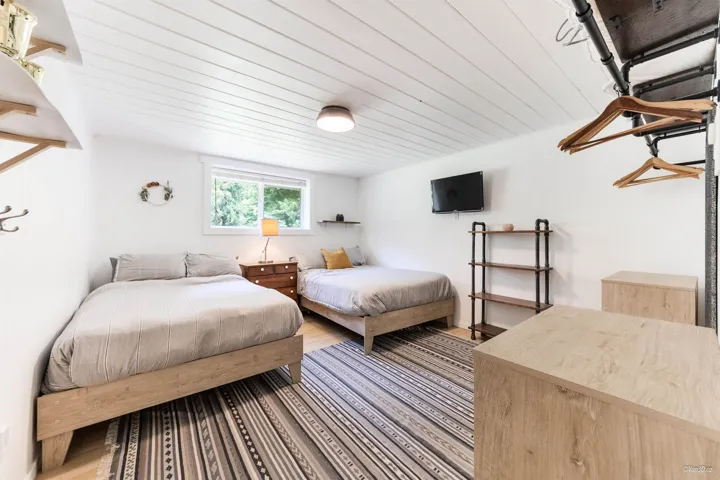 Bedroom featuring wood ceiling and wood finished floors