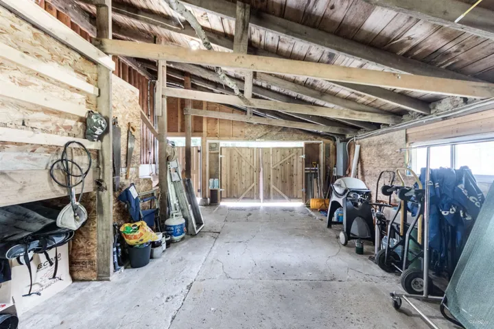 Miscellaneous room featuring wooden walls