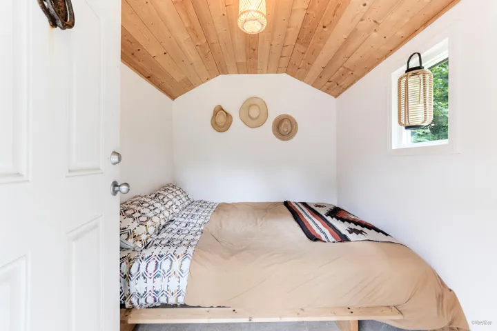 Bedroom featuring a vaulted wood ceiling