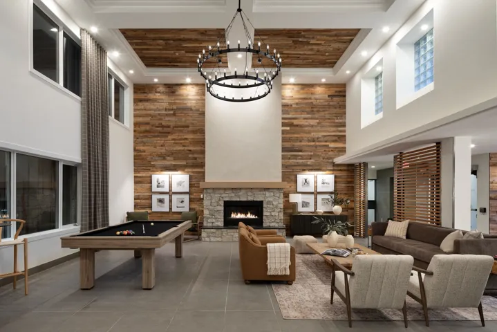 Living area featuring a high ceiling, a fireplace, recessed lighting, and billiards table